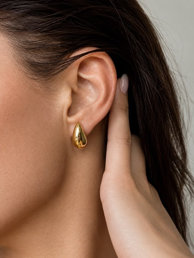 TAMA earrings worn